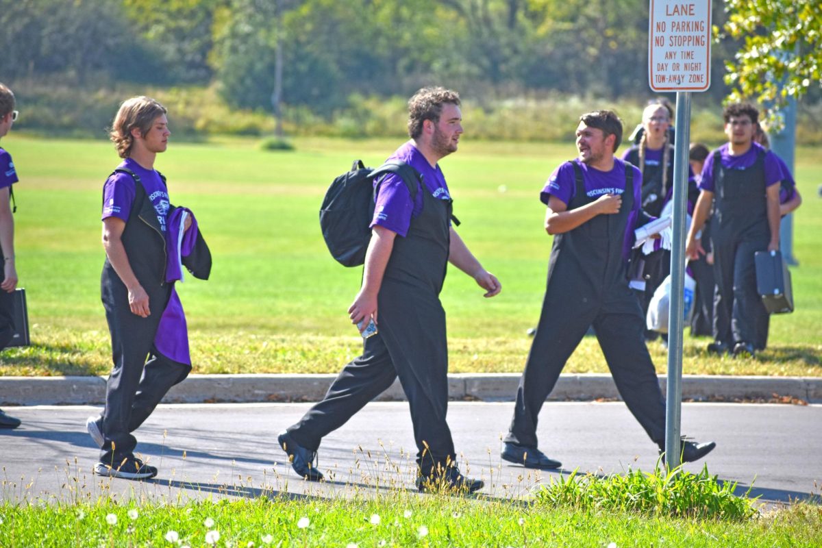 UW-Whitewater Marching Band members board the bus bound for the Milwaukee Brewers behind the Williams Center Sept. 27, 2025.