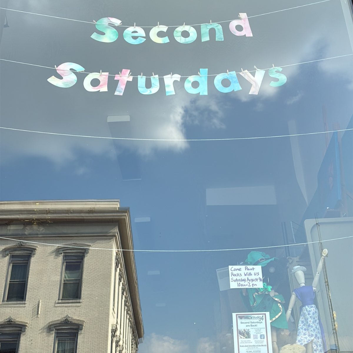 Studio 84's new handmade window art welcomes the community in.
