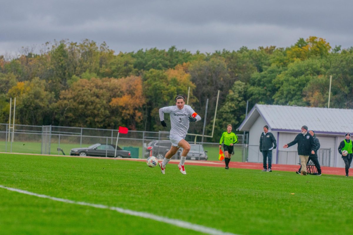 The UW-Whitewater senior forward Cooper Re dribbles the ball up the field against Millikin University on Oct. 22nd, 2025 at Robert Fiskum Field.