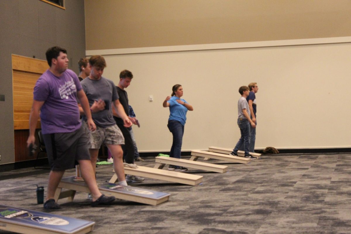 University students and cornhole members practice for the tournament.
