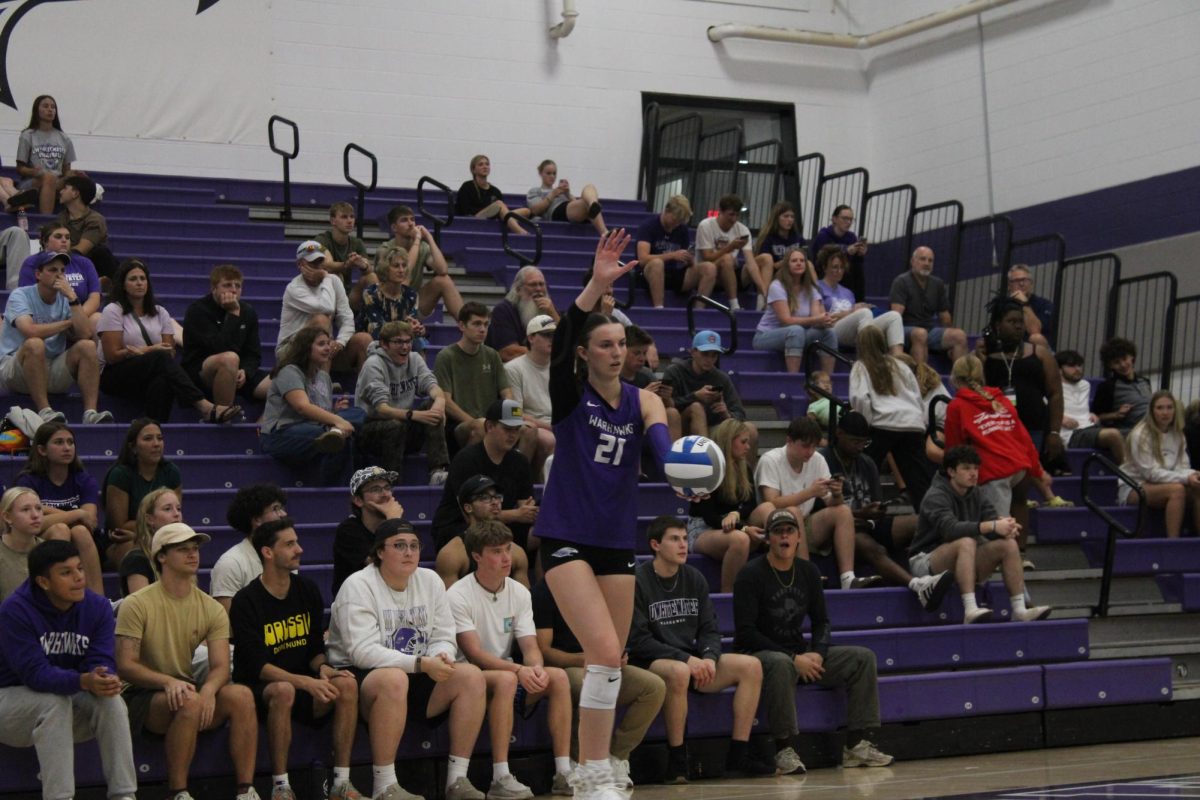 Setter Aubrie Kruz in position to serve, Wednesday, Oct.1.