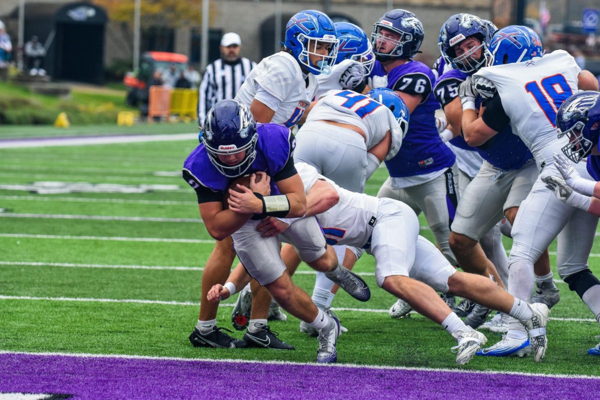 The UW-Whitewater sophomore quarterback Justin Klinkner lunges towards the end zone scoring a touchdown against UW-Platteville on Sept. 25th, 2025 at Perkins Stadium.
