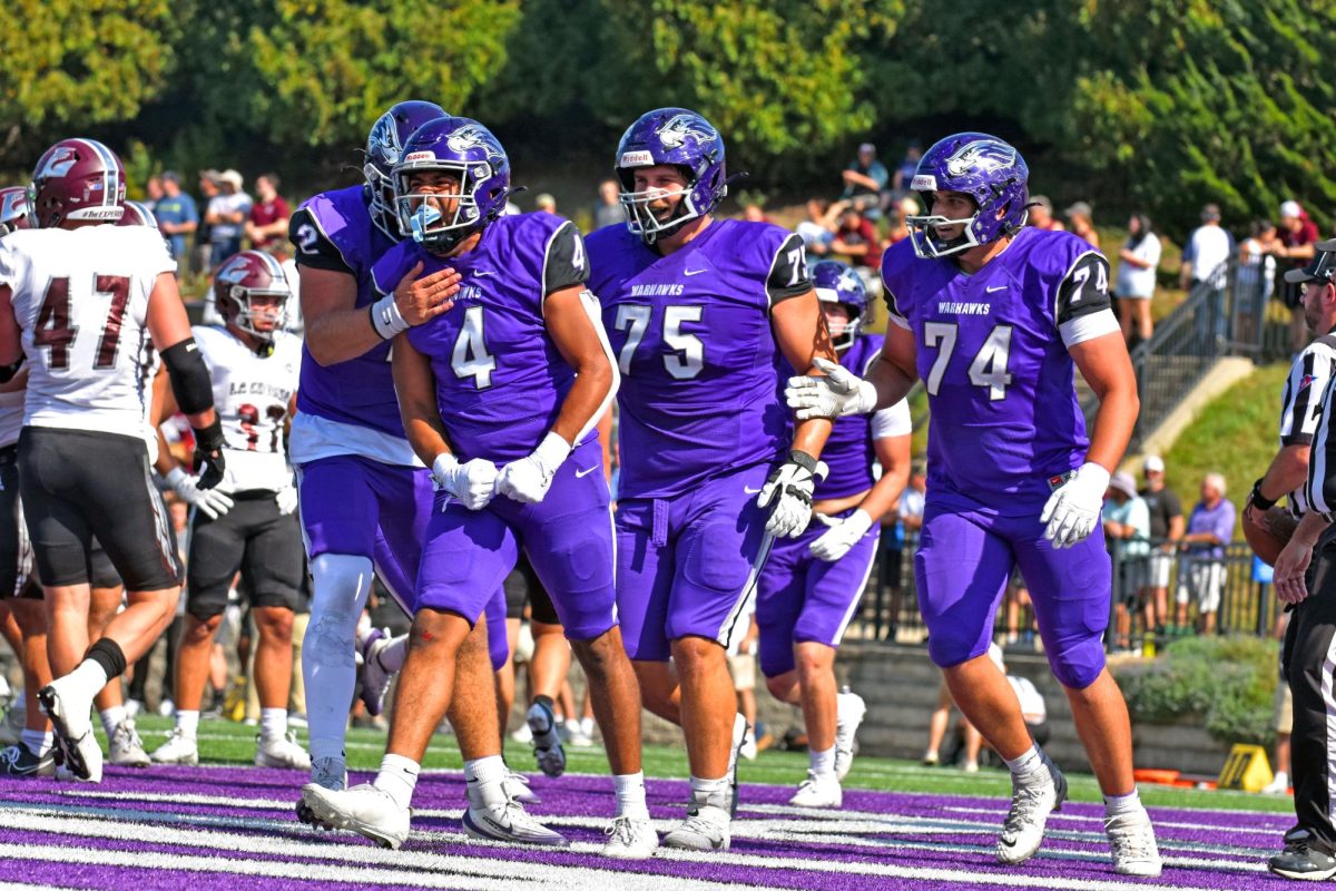 The UW-Whitewater football offense line celebrates after getting first down to advance the ball against UW-La Crosse on Oct. 4 2025 at Perkins Stadium.