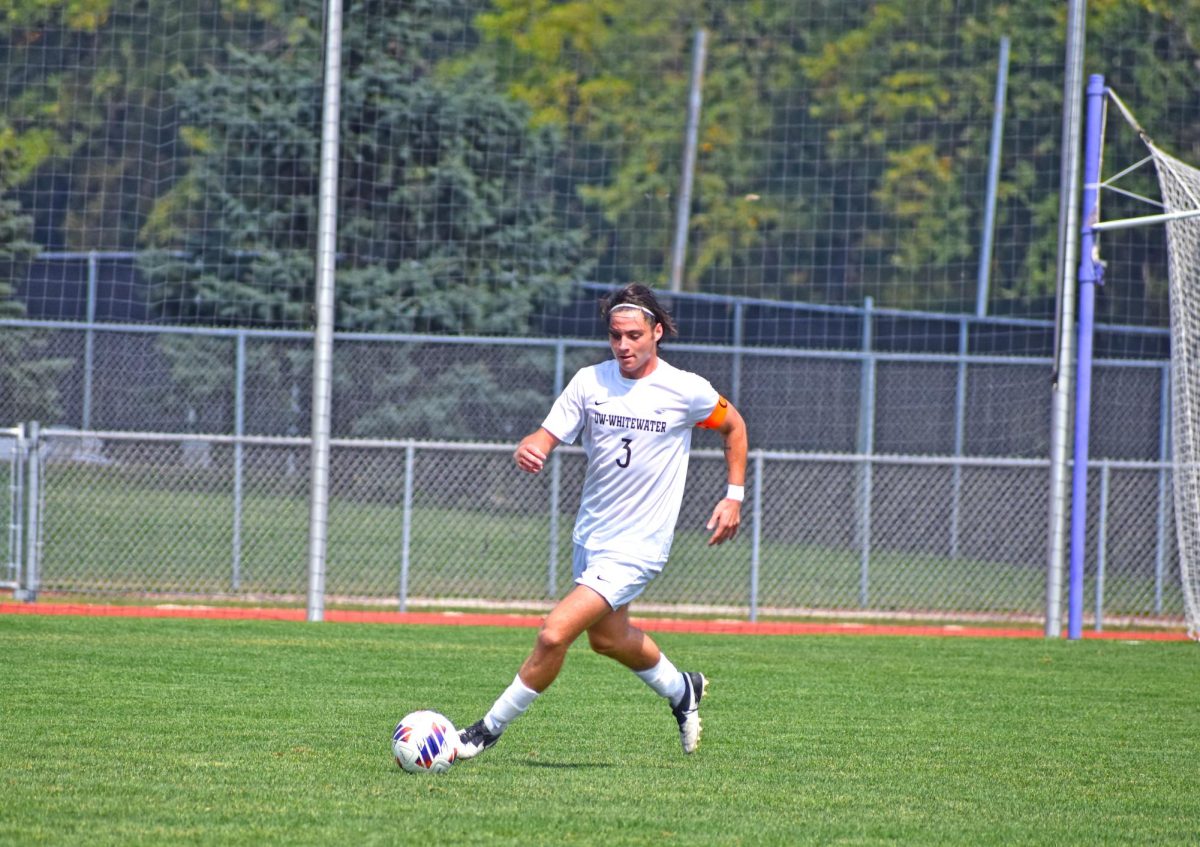 The UW-Whitewater senior forward Cooper Re dribbles the ball up the field against Augsburg University on Sept. 13th 2025 at Robert Fiskum Field.
