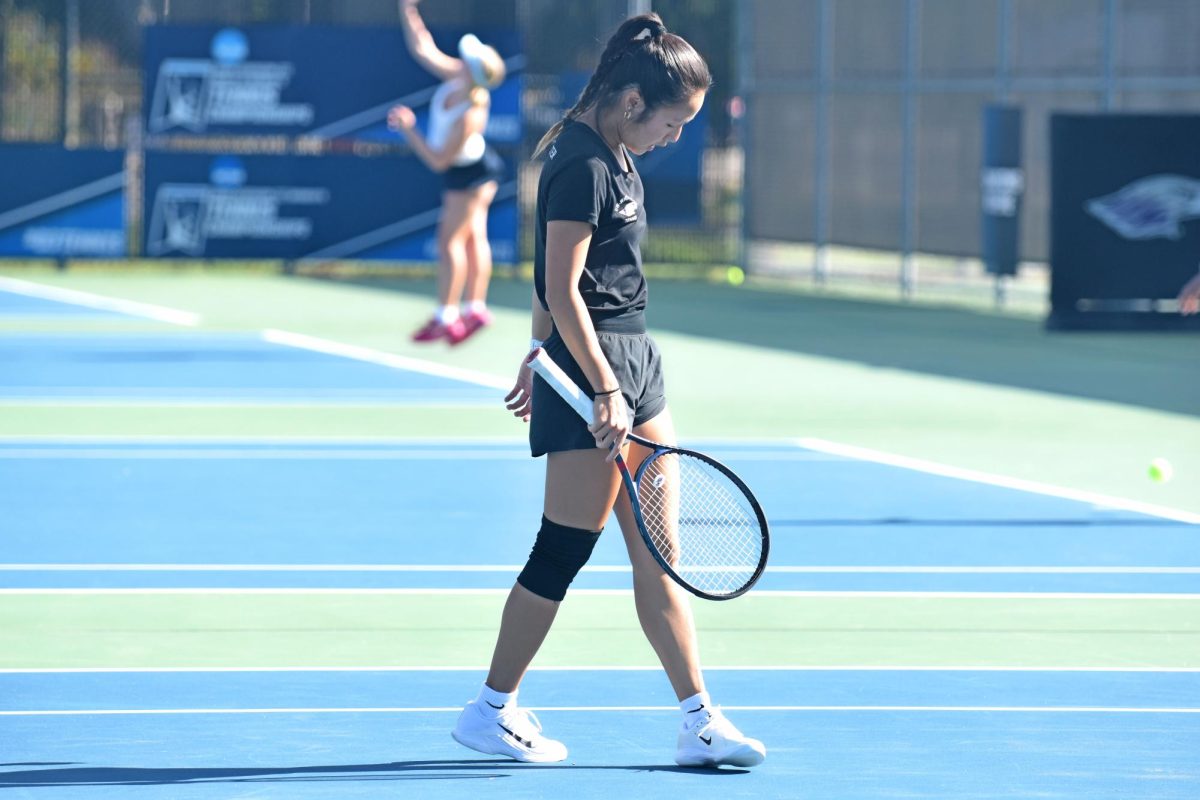 The UW-Whitewater senior Gracie Ha prepares herself to go against her first round opponent on Oct. 18, 2025, at the Wangerin Tennis Courts.