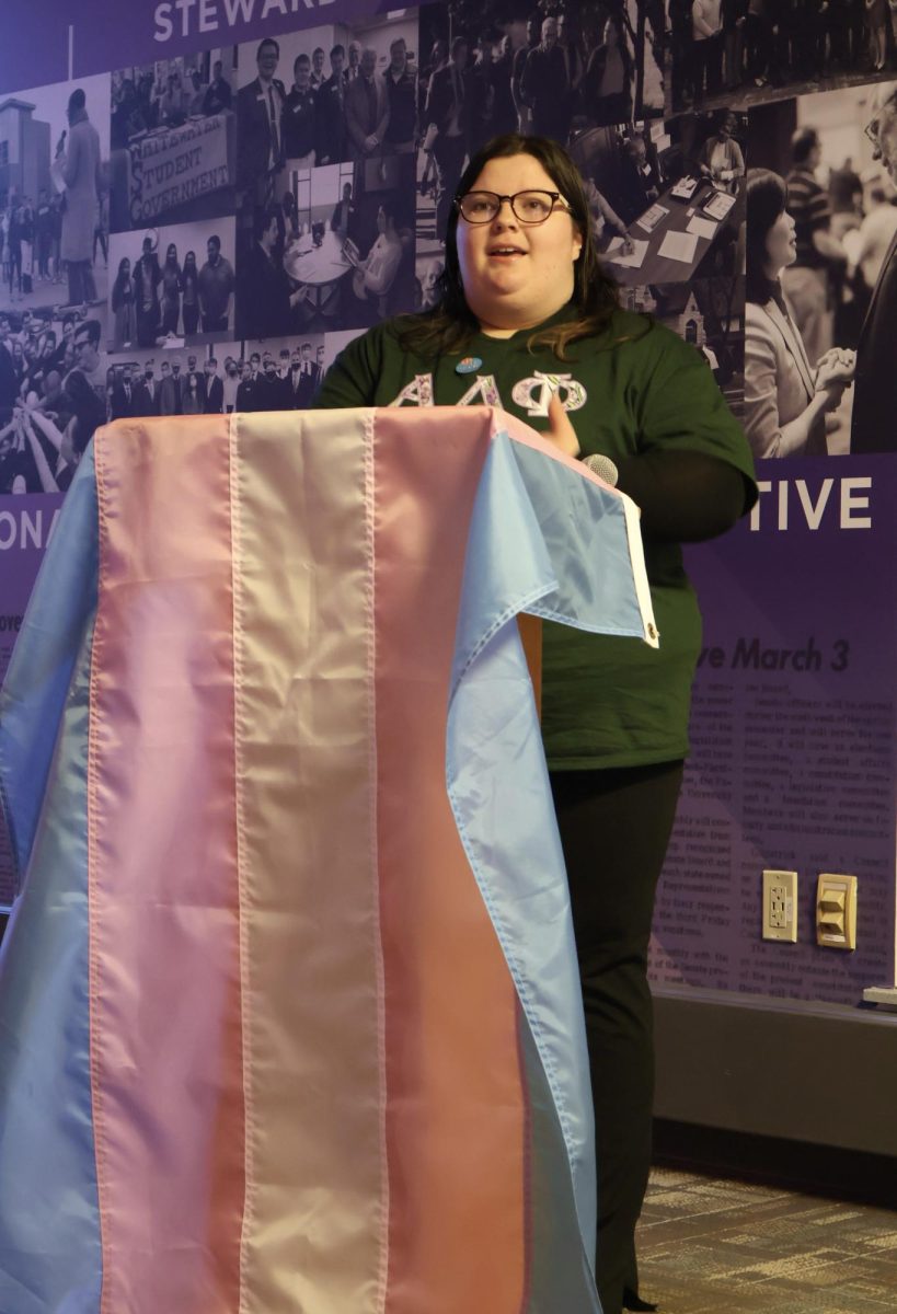 Impact president Jaelyn Krohn gives a statement about the LGBTQIA+ organization during the Nov 19 Trans Day of Remembrance & Resilience event.
