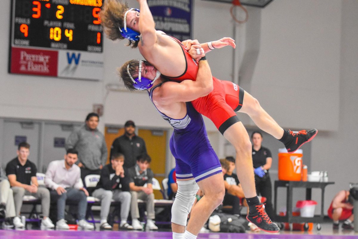  The UW-Whitewater wrestler junior Gavin Kohel picks up and slams his opponent from North Central College at the Kachel Gymnasium on Nov. 15, 2025.