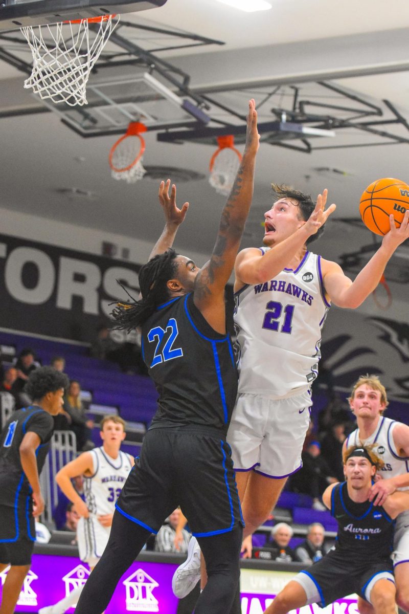 The UW-Whitewater junior forward Brock Marino goes for a layup against Aurora University on Nov. 19, 2025 at the Kachel Gymnasium. 