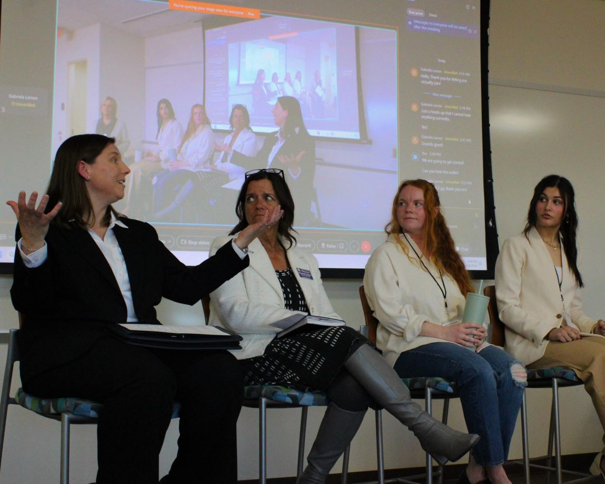 Panelists Sofia Polenz, Elena Gildemeister, and Tara Willis listen to April Devalkenaere describe the joy she gets from owning her own business.