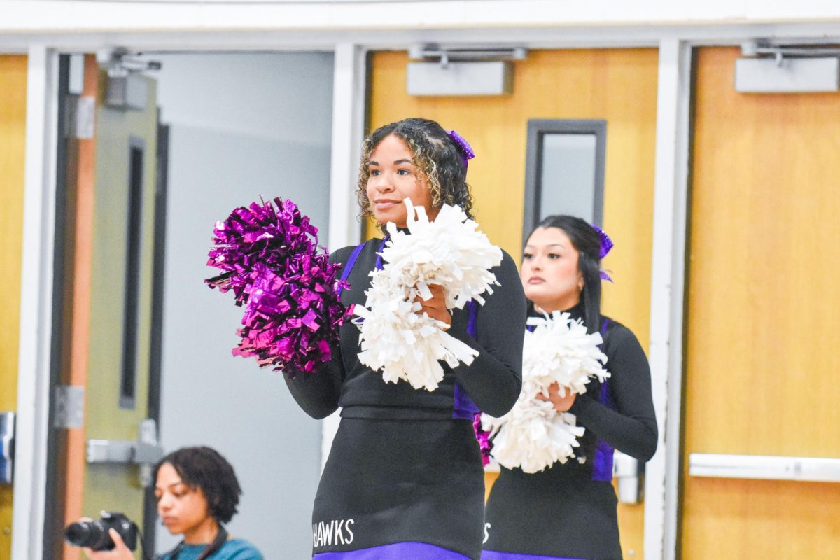 The UW-Whitewater Club Cheer team cheers on the UW-Whitewater Men’s Basketball team on the sidelines on Feb. 11, 2026 in the Kachel Gymnasium.