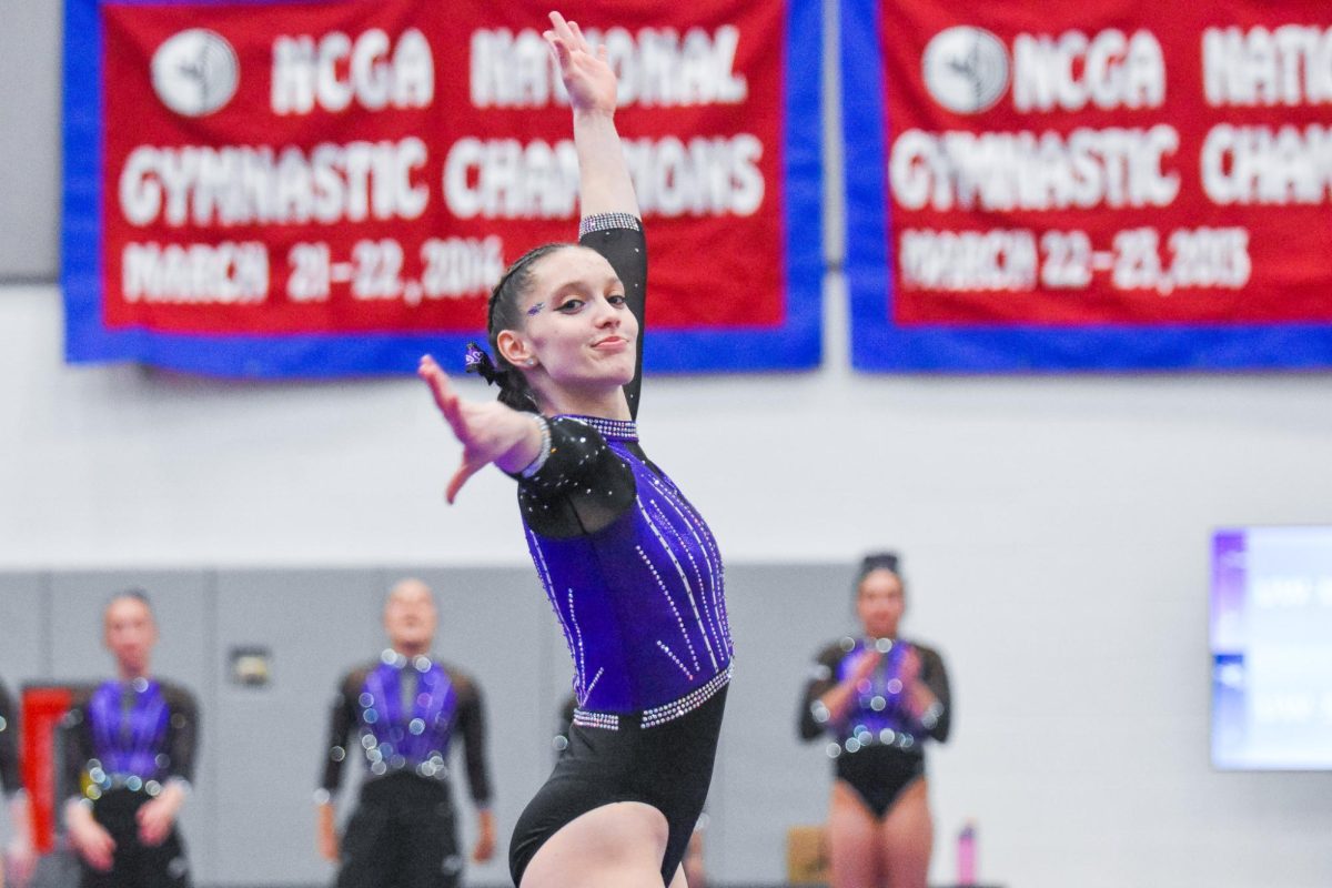 The UW-Whitewater Warhawk freshman all-around Juliette Rider struts as she completes her floor routine against UW-Stout in the Kris Russell Volleyball Arena on Feb.14, 2026.

