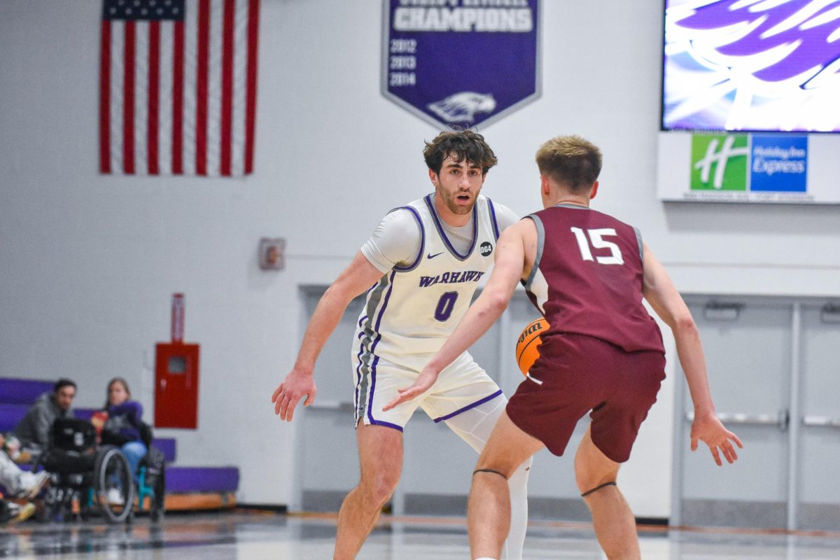 The UW-Whitewater Warhawk senior guard Isaac Verges dribbles thinking of a play to score on UW-La Crosse on Feb. 4, 2026 in the Kachel Gymnasium. 