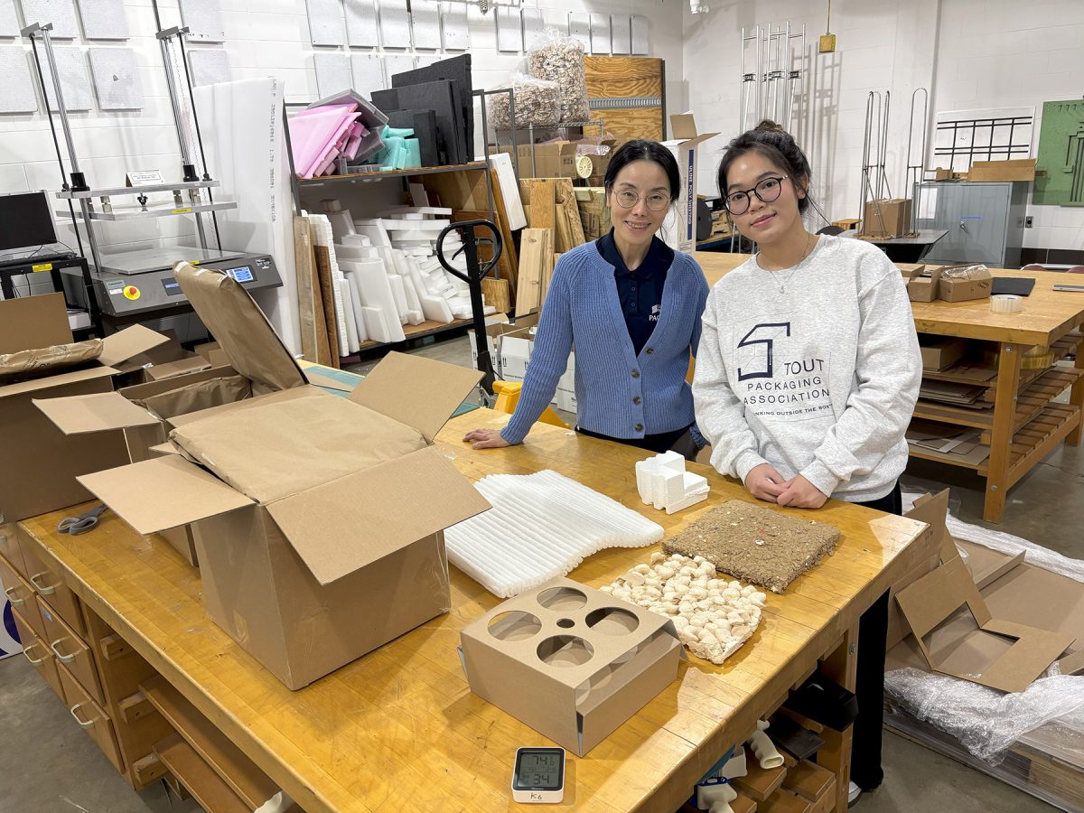 UW-Stout Assistant Professor Kate Liu, left, and her lab assistant, sophomore Claire Le, pose with materials in the packaging lab. / UW-Stout