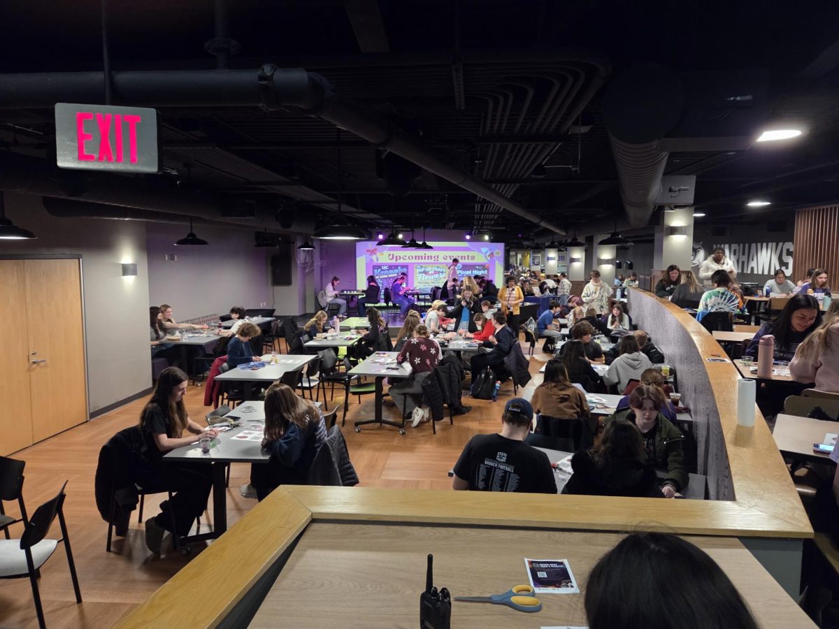Students come together to create their beaded companion of choice as music surrounds them, mixed with the conversations from others in the UC Live on March 18, 2026.