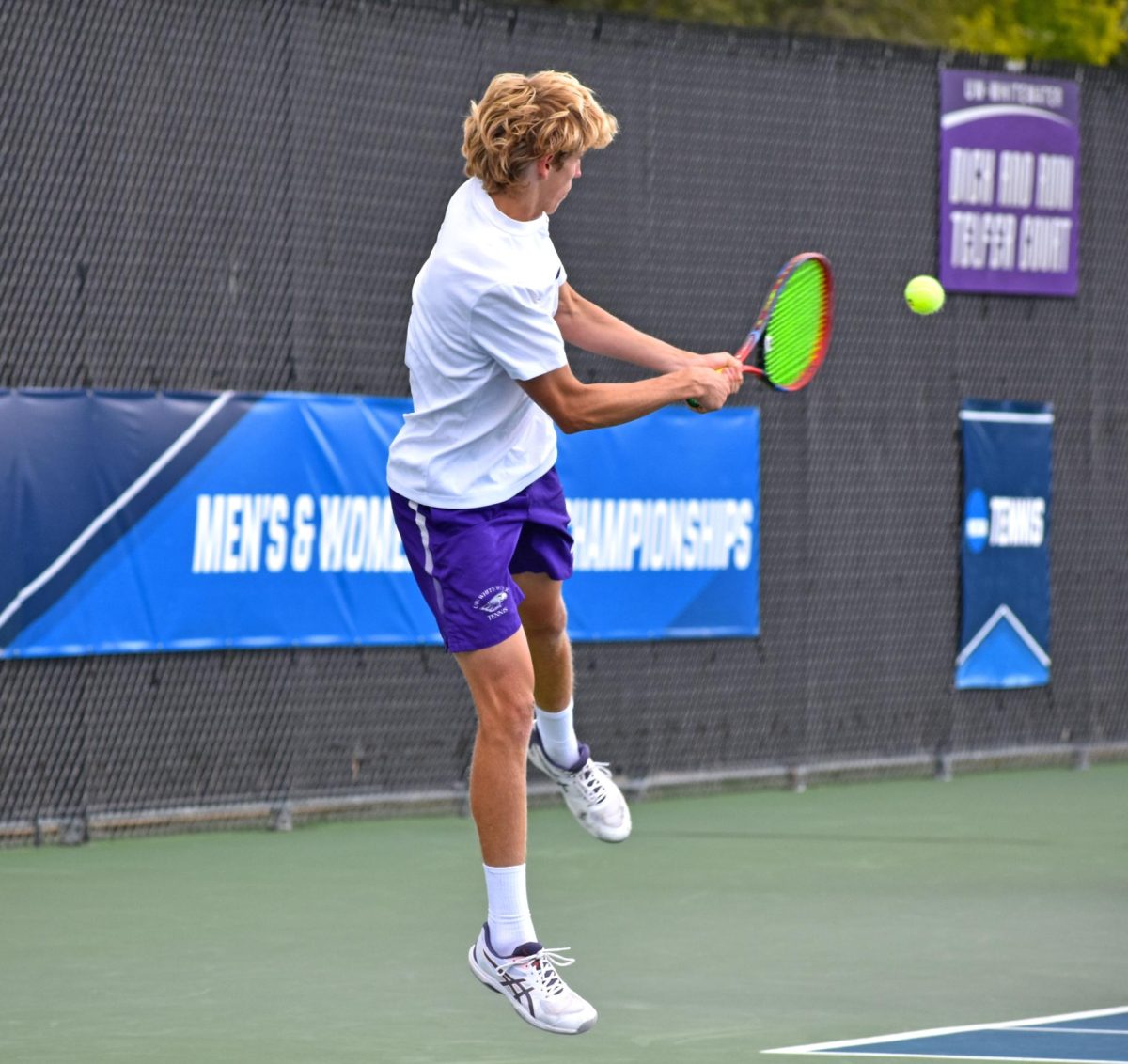 The UW-Whitewater Warhawk men’s tennis freshman Carter Michaels hits his ball aggressively against his opponent from Olivet Nazarene University at the Warhawk Outdoor Tennis Complex, Sep 5, 2026. 
