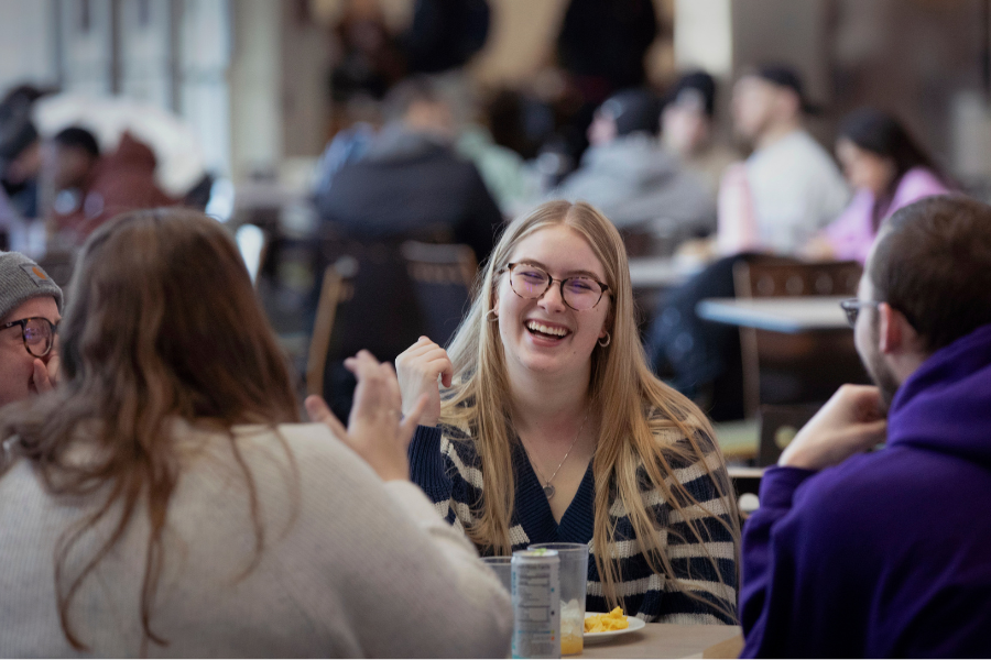 Lillian Groblewski, a communication sciences and disorders student from Lake Villa, Illinois, meets up with friends in the University Center on Monday, Jan. 27, 2025. (UW-Whitewater photo/Craig Schreiner)