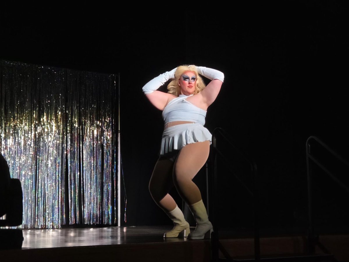 Lavender Jones comes out in a muted baby blue set, confidently moving to the music while keeping it classy as the audience cheers her on throughout her performance at the drag show on April 9th in the Hamilton Room.