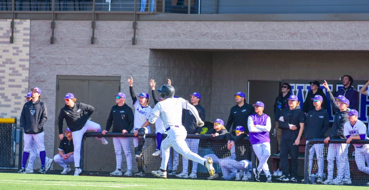 :The UW-Whitewater Warhawk baseball junior catcher Aaron Holland runs the bases as he hits a solo home run against UW-Oshkosh in the second game of the doubleheader, April 8, 2026 at Prucha Field. 

