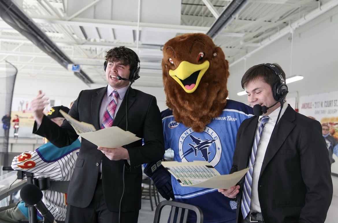 Commentators Zach Criter and Christopher Flynn  watch and analyze as the Janesville Jets play in Woodman’s Sports and Convention Center. (Courtesy of the Janesville Jets) 