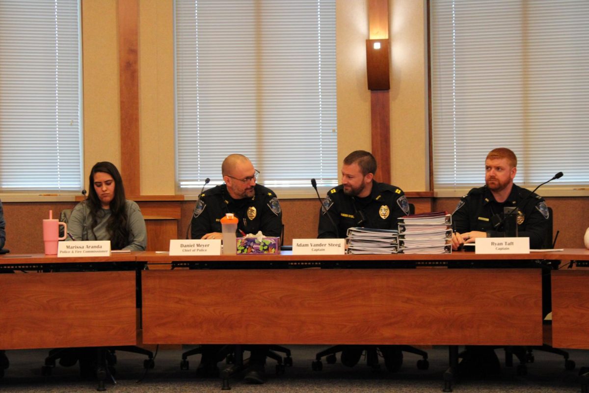 Cheif of Police Daniel Meyer and Captain Adam Vander Steeg discussing agenda items before the session begins.