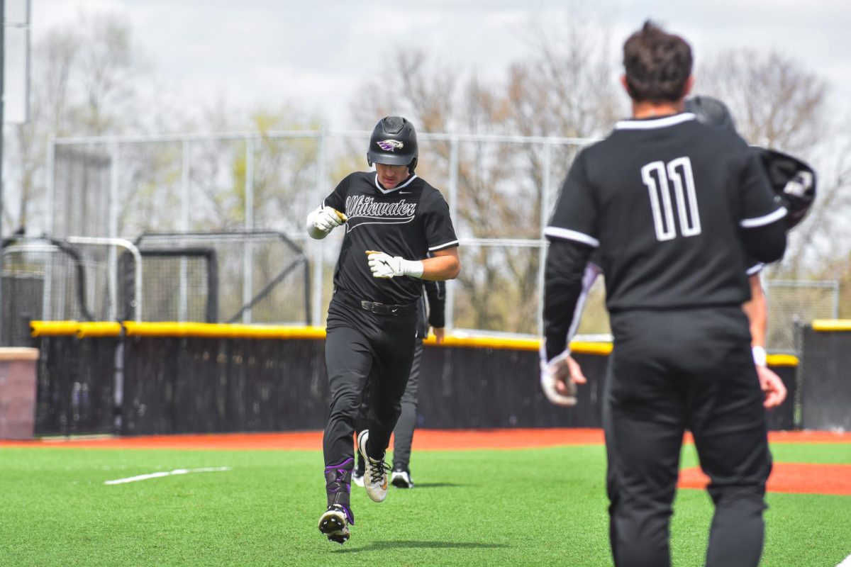 The UW-Whitewater Warhawk baseball senior second baseman Andy Thies comes around third after hitting a three run home run against UW-Platteville at Prucha Field, April 18, 2026. 
