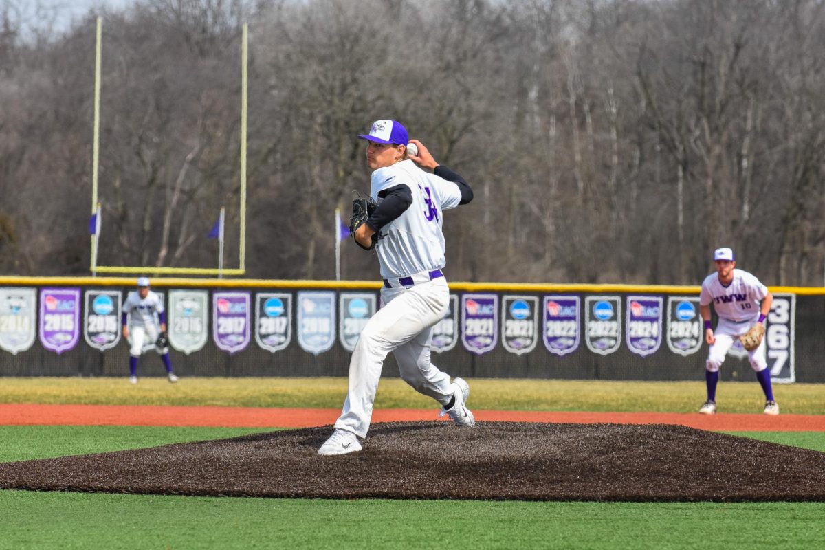 The UW-Whitewater Warhawk baseball junior pitcher Jackson Koenig winds up to release a pitch against the UW-Stevens Point batter, March 29, 2026 at the Prucha Field. 
