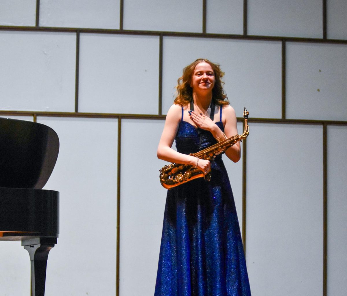 UW-Whitewater senior Natalie Illikainen celebrates as the audience applauds her at the senior showcase in the Light Recital Hall in the Center of the Arts, April 26, 2026. 